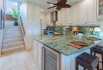 The beautiful, emerald granite countertops bring the rich colors of the outside in